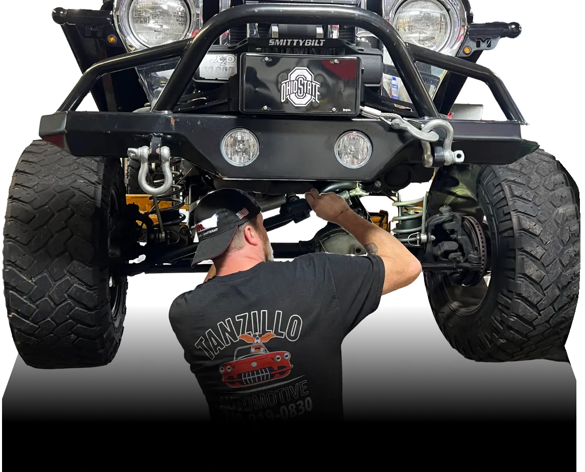 Mechanic working on off-road vehicle